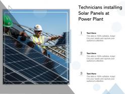 Technicians installing solar panels at power plant