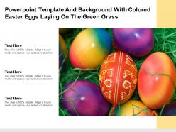 Template and background with colored easter eggs laying on the green grass