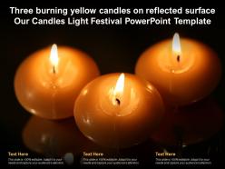 Three burning yellow candles on reflected surface our candles light festival template