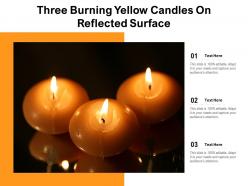 Three burning yellow candles on reflected surface