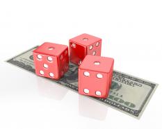 Three dices on dollars finance stock photo