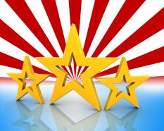 Three golden stars on red and white background stock photo