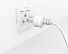 Three pin plug infront of socket for problem solving display stock photo