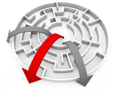 Three rounded arrows in maze showing leadership by red arrow stock photo