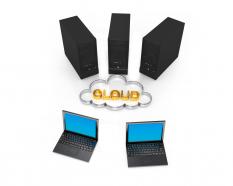 Three servers with cloud and two laptops stock photo