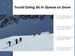 Tourist doing ski in queue on snow