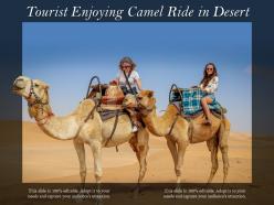 Tourist enjoying camel ride in desert