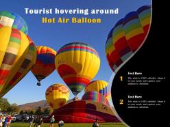 Tourist hovering around hot air balloon