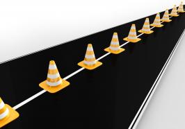 Traffic cones on roadmap for business stock photo