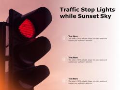 Traffic stop lights while sunset sky