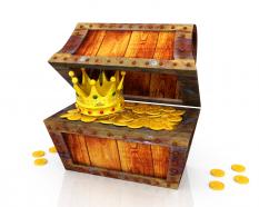 Treasure box with crown and gold coins stock photo