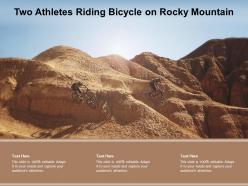 Two athletes riding bicycle on rocky mountain
