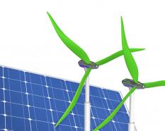 Two green windmill solar panel stock photo