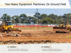 Two heavy equipment machinery on ground field