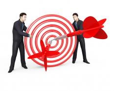 Two man with 3d target and dart showing business target stock photo