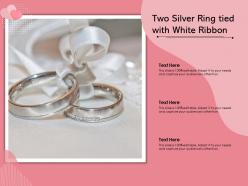 Two silver ring tied with white ribbon