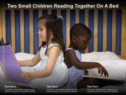 Two small children reading together on a bed