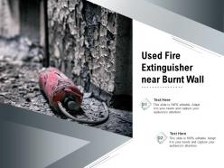 Used fire extinguisher near burnt wall