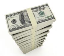 Vertical stack of dollars stock photo