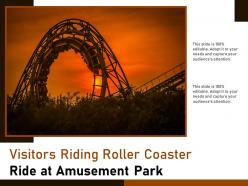 Visitors riding roller coaster ride at amusement park