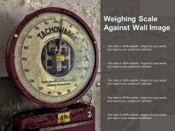 Weighing scale against wall image