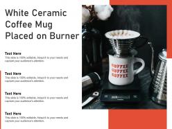 White ceramic coffee mug placed on burner
