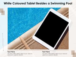 White coloured tablet besides a swimming pool