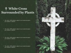 White cross surrounded by plants