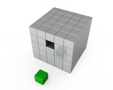 White cube with one green cube shows leadership stock photo