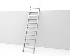 White ladder on wall success concept stock photo