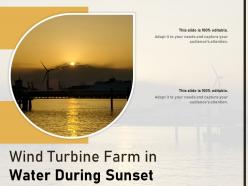 Wind turbine farm in water during sunset