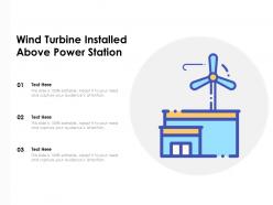 Wind turbine installed above power station