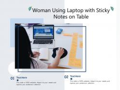 Woman using laptop with sticky notes on table