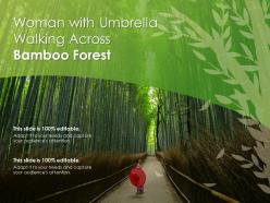 Woman with umbrella walking across bamboo forest