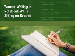 Woman writing in notebook while sitting on ground