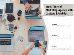Work table of marketing agency with laptops and mobiles