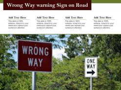 Wrong way warning sign on road