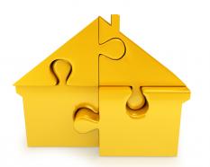 Yellow colored puzzle with hut shape stock photo