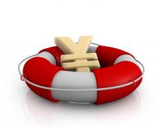 Yen symbol in lifesaver showing concept of financial crisis stock photo