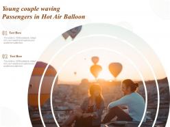 Young couple waving passengers in hot air balloon