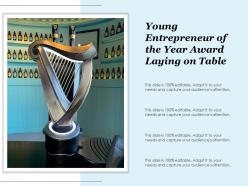 Young entrepreneur of the year award laying on table