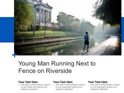 Young man running next to fence on riverside