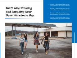 Youth girls walking and laughing near open warehouse bay