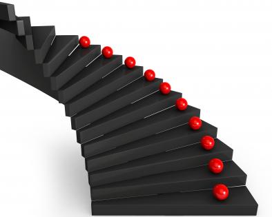 0115 red balls on black stairs stock photo