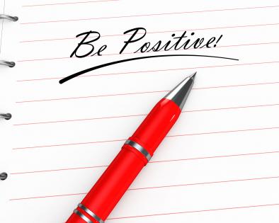 0914 be positive text on notebook with pen stock photo