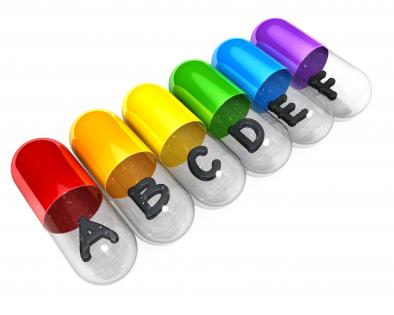 0914 colorful capsules with letters on white background stock photo
