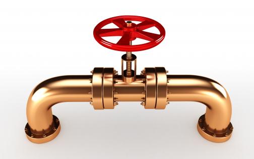 0914 copper pipeline with red valve in center stock photo