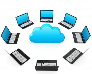 0914 network of laptops around cloud for cloud computing stock photo