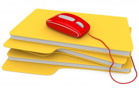 0914 red mouse on stack of folders for technology stock photo