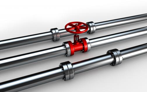 0914 silver water supply pipelines with red valve stock photo